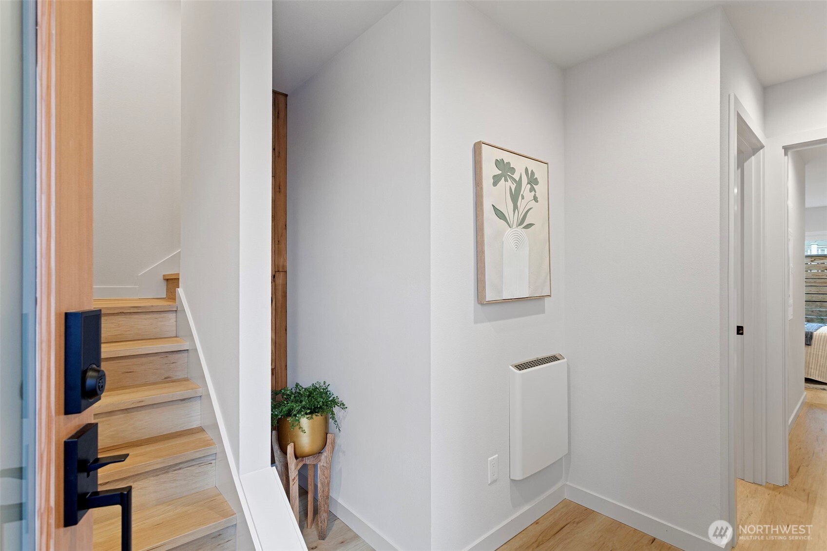 926 Northwest 57th Street, Unit B Seattle, WA 98107 - Photo 3 of 37 a view of an entryway with wooden floor