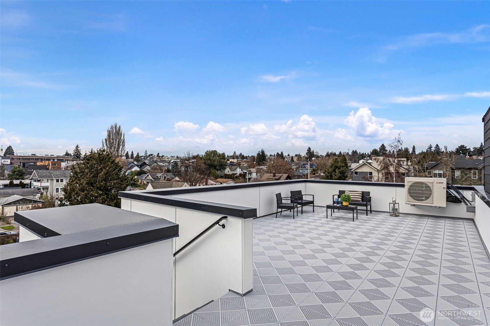 926 Northwest 57th Street, Unit B Seattle, WA 98107 - Photo 31 of 37 a terrace with a city view