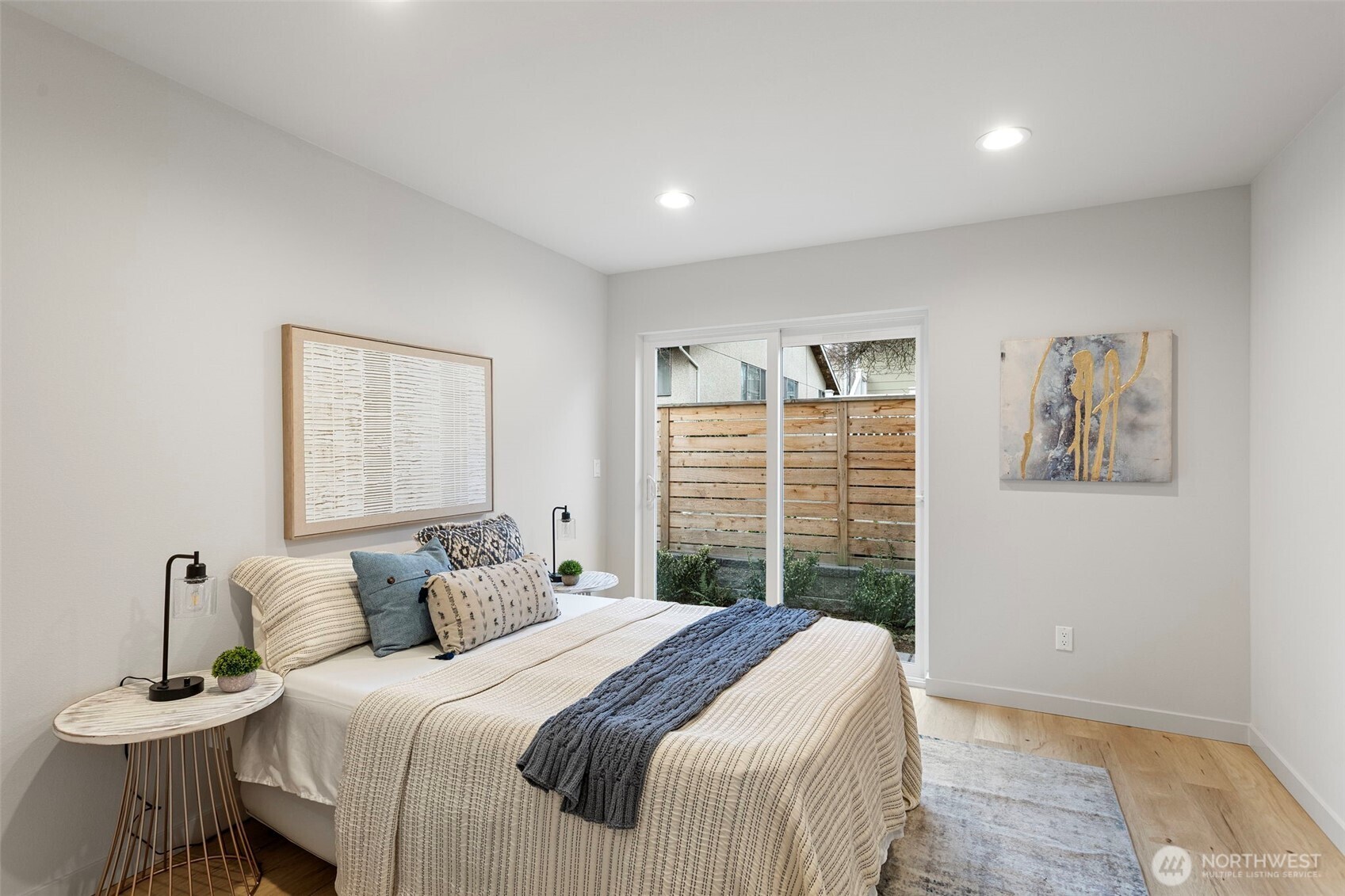 926 Northwest 57th Street, Unit B Seattle, WA 98107 - Photo 8 of 37 a bedroom with a bed and a table