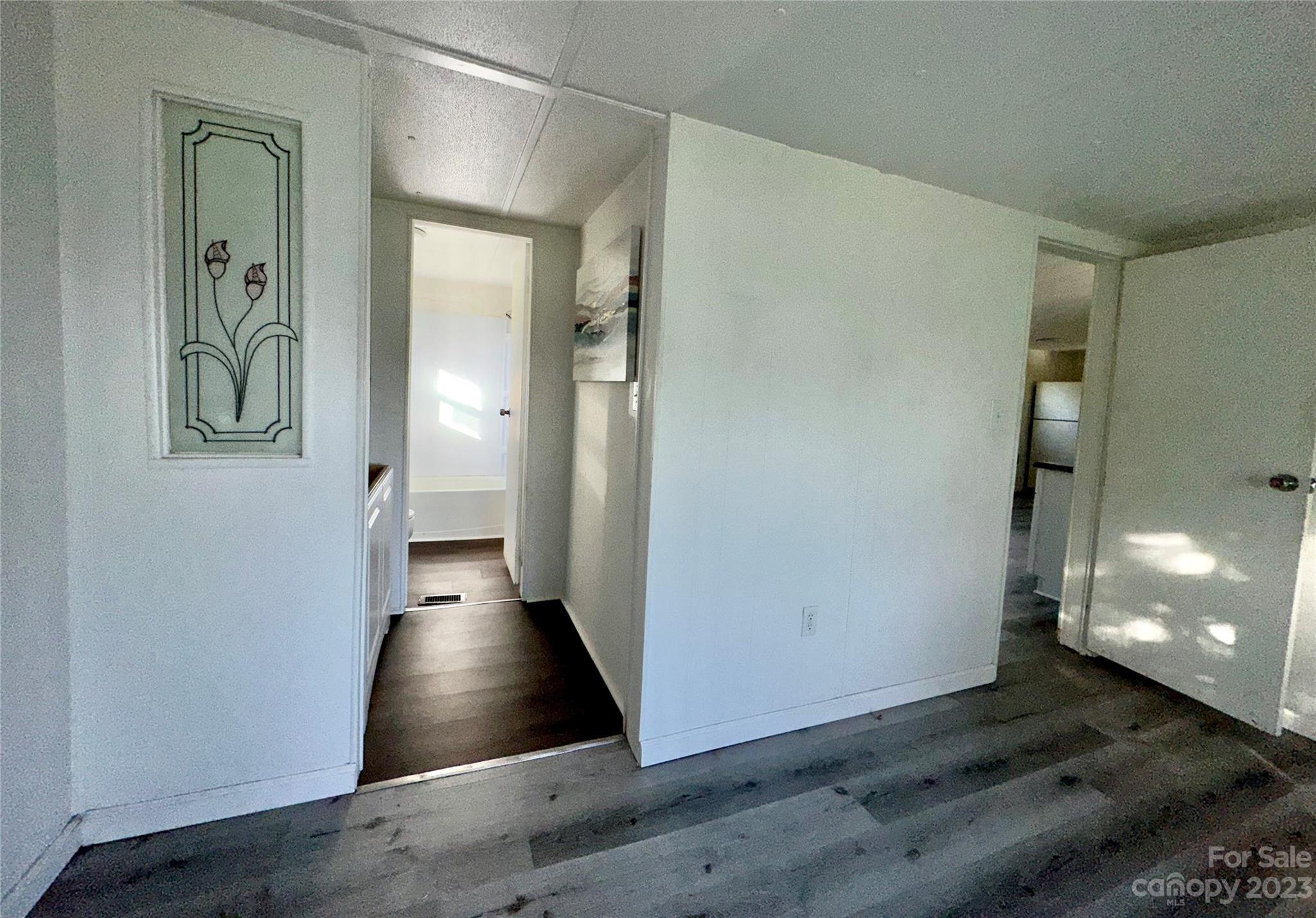 3378 Startown Road Newton, NC 28658 - Photo 15 of 30 a view of a hallway with wooden floor