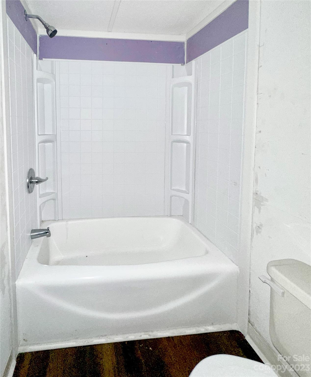 3378 Startown Road Newton, NC 28658 - Photo 18 of 30 a bathroom with a bathtub and a toilet