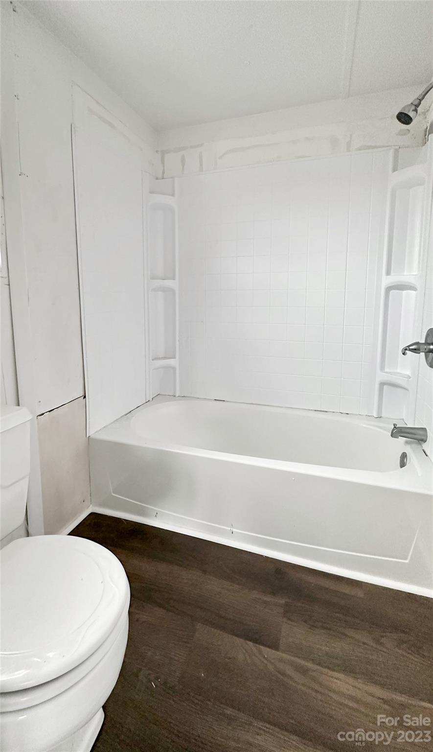 3378 Startown Road Newton, NC 28658 - Photo 21 of 30 a bathroom with a toilet and a bathtub