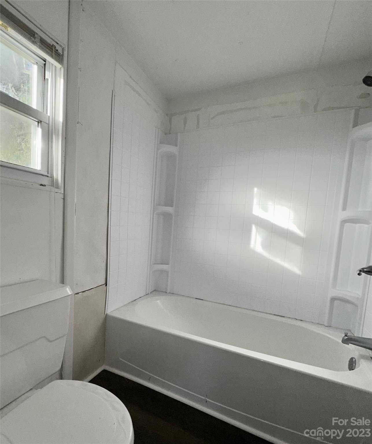 3378 Startown Road Newton, NC 28658 - Photo 22 of 30 a bathroom with a bathtub and a toilet