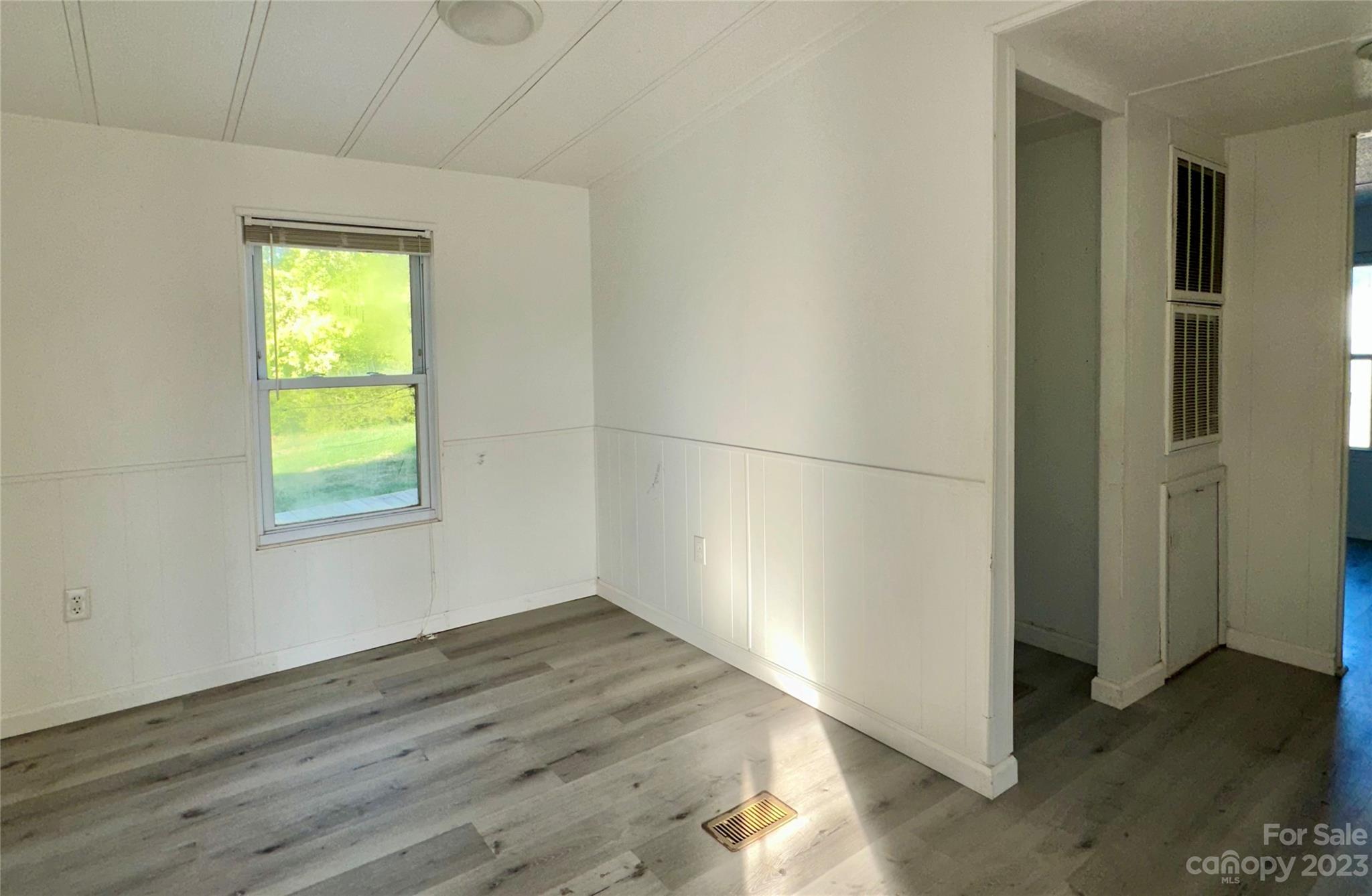 3378 Startown Road Newton, NC 28658 - Photo 24 of 30 a view of empty room with wooden floor and fan