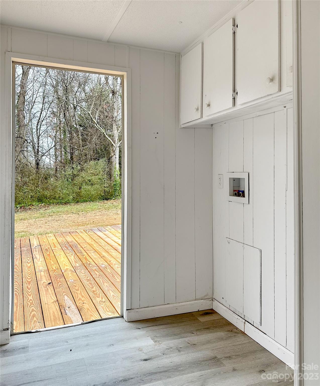 3378 Startown Road Newton, NC 28658 - Photo 25 of 30 a view of an empty room with wooden floor and a window