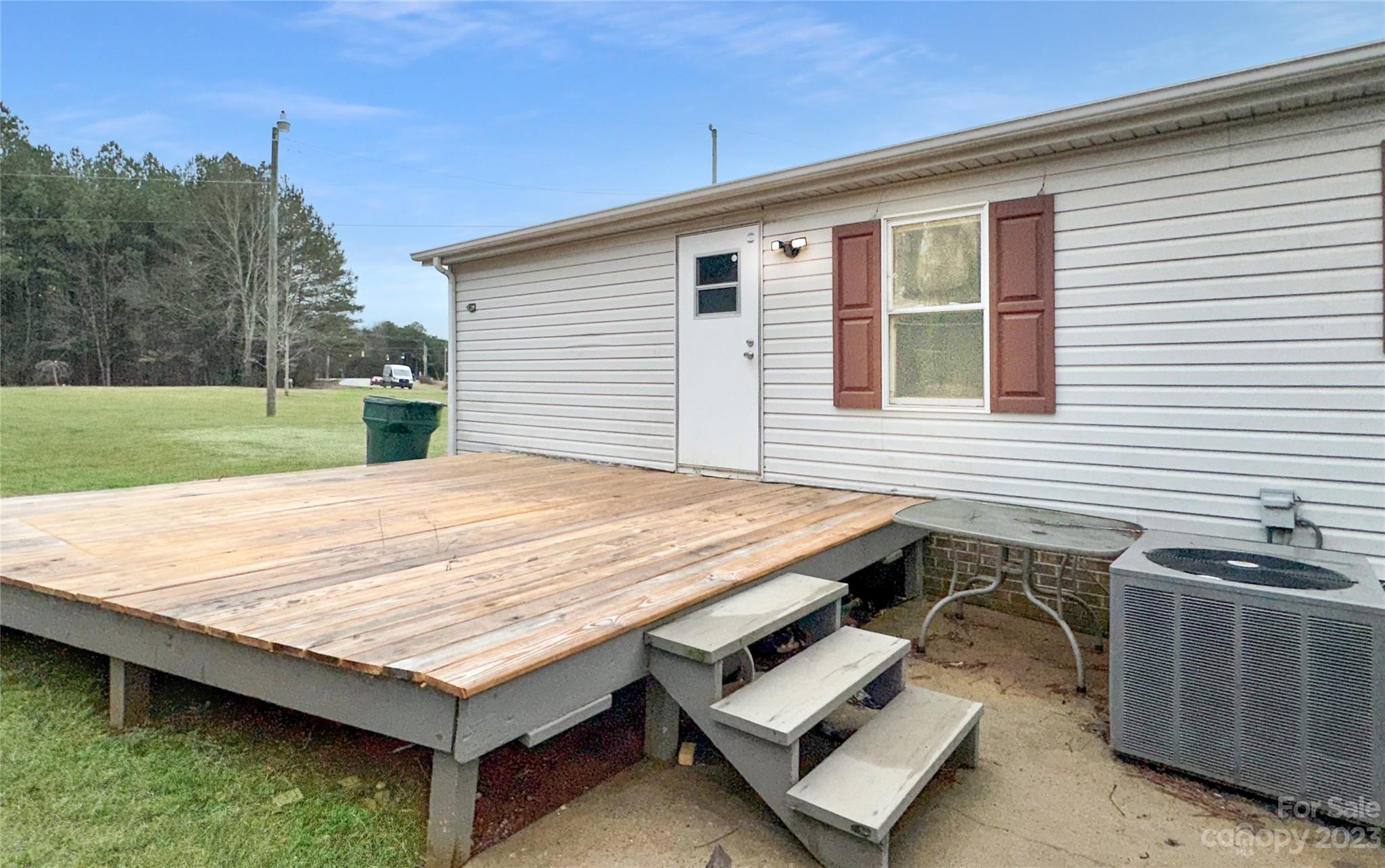 3378 Startown Road Newton, NC 28658 - Photo 26 of 30 a view of a wooden deck and a backyard