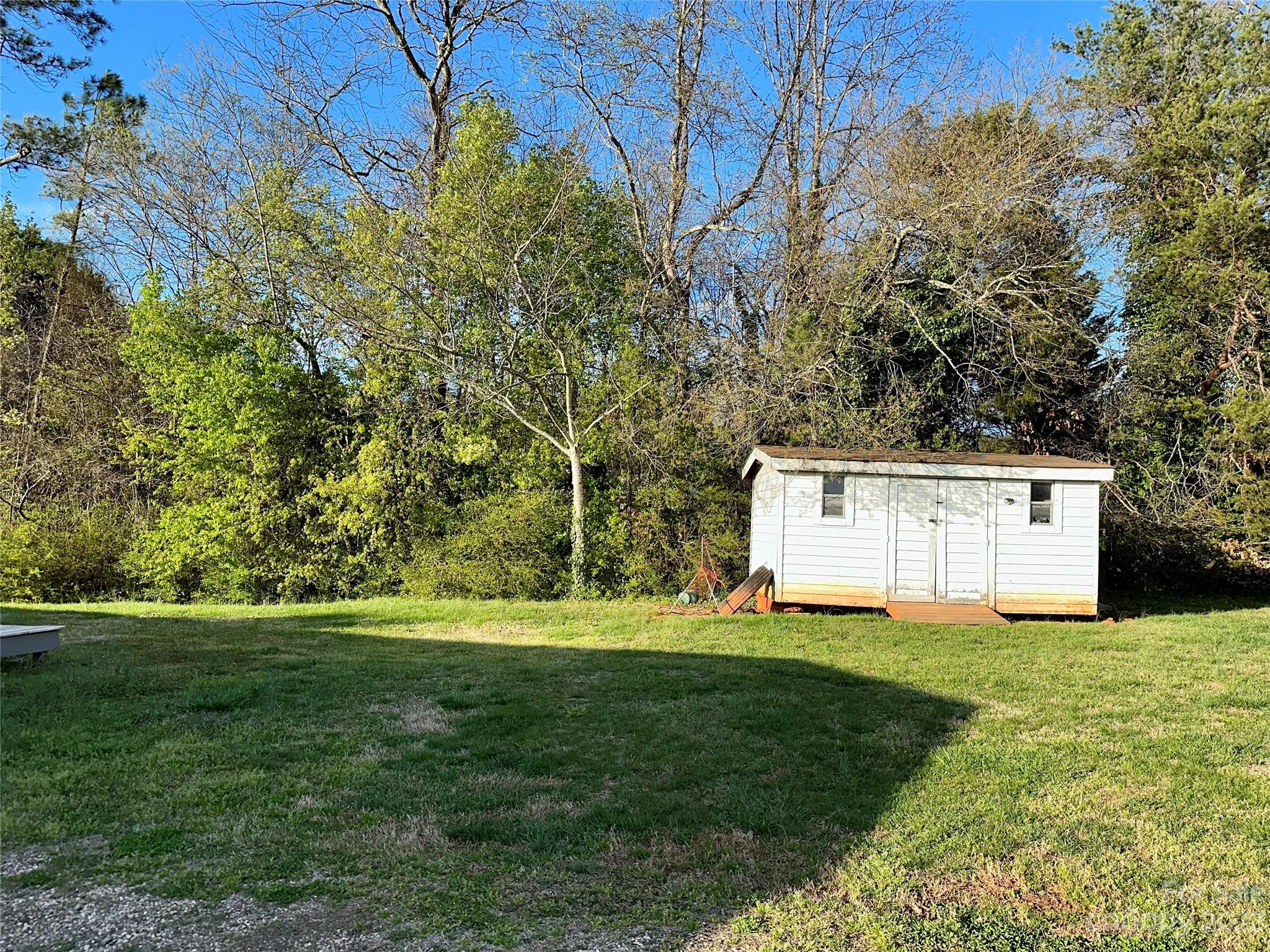 3378 Startown Road Newton, NC 28658 - Photo 27 of 30 a view of a house with a yard and garage