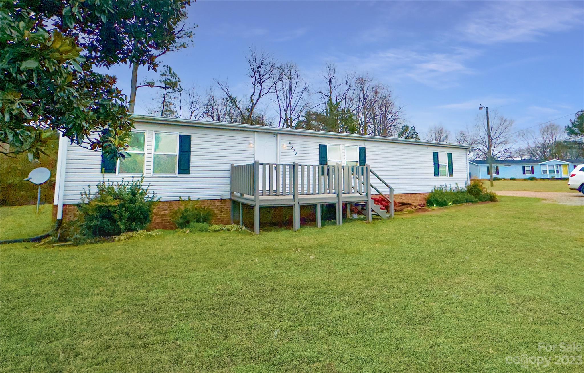3378 Startown Road Newton, NC 28658 - Photo 30 of 30 a view of a house with a yard porch and sitting area