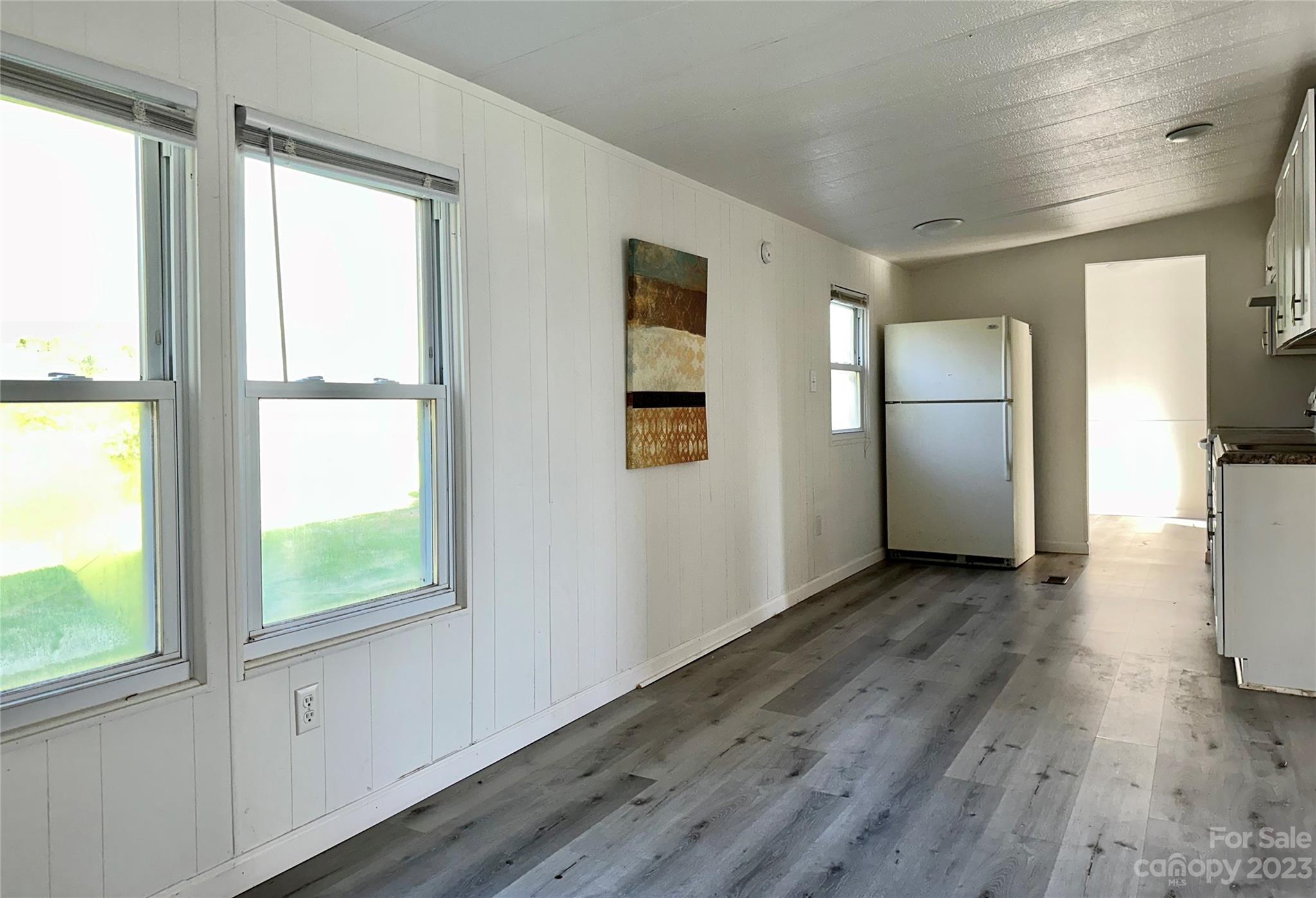3378 Startown Road Newton, NC 28658 - Photo 5 of 30 a view of a refrigerator in kitchen and wooden floor