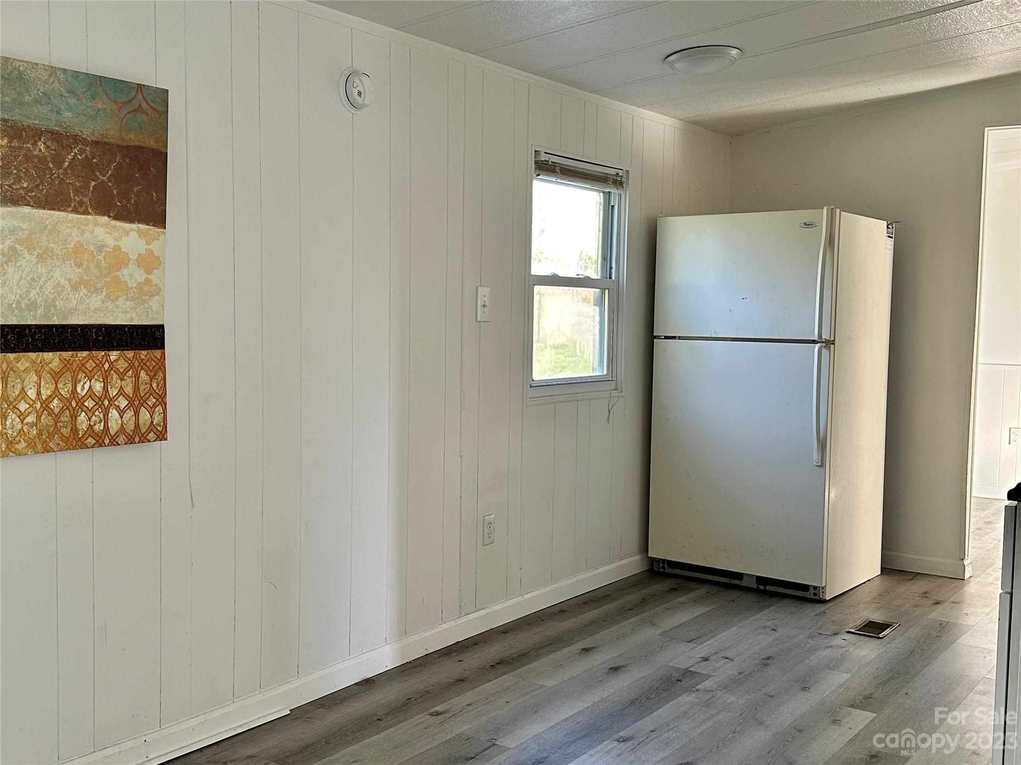 3378 Startown Road Newton, NC 28658 - Photo 7 of 30 a view of a kitchen with wooden floor and window