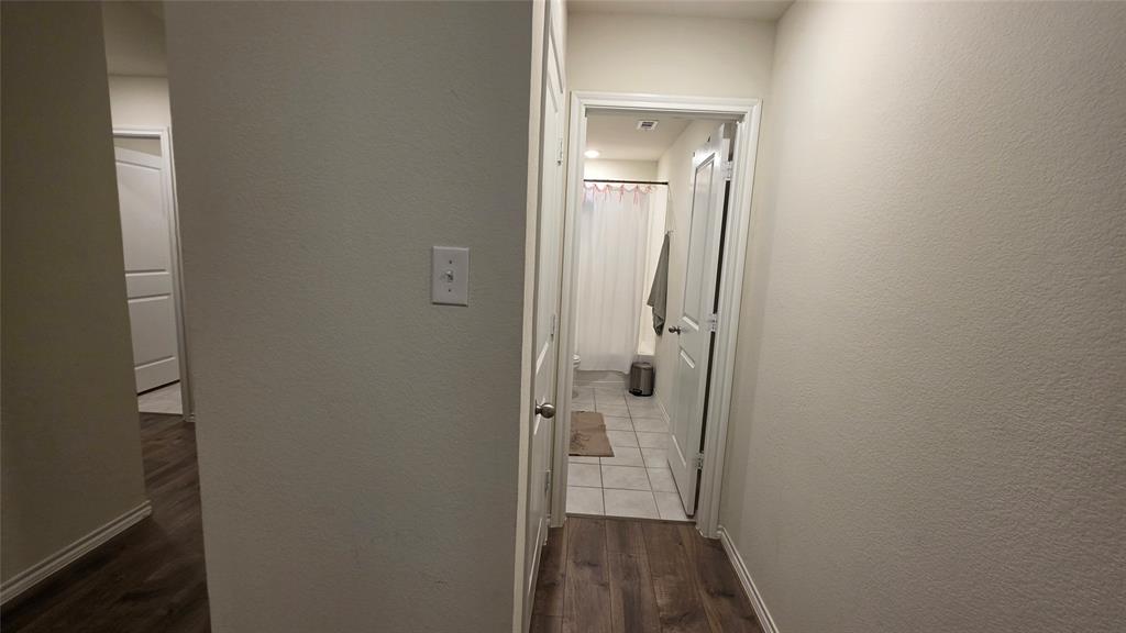409 Samuel Street Denton, TX 76207 - Photo 10 of 40 a view of a bathroom from a hallway