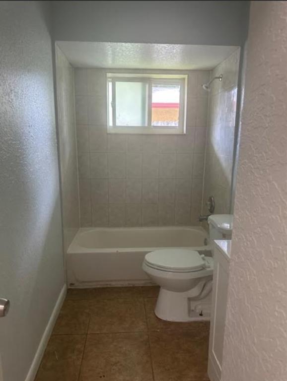 332 Southwest 2nd Place, Unit 3 Pompano Beach, FL 33060 - Photo 5 of 11 a bathroom with a toilet a sink and bathtub