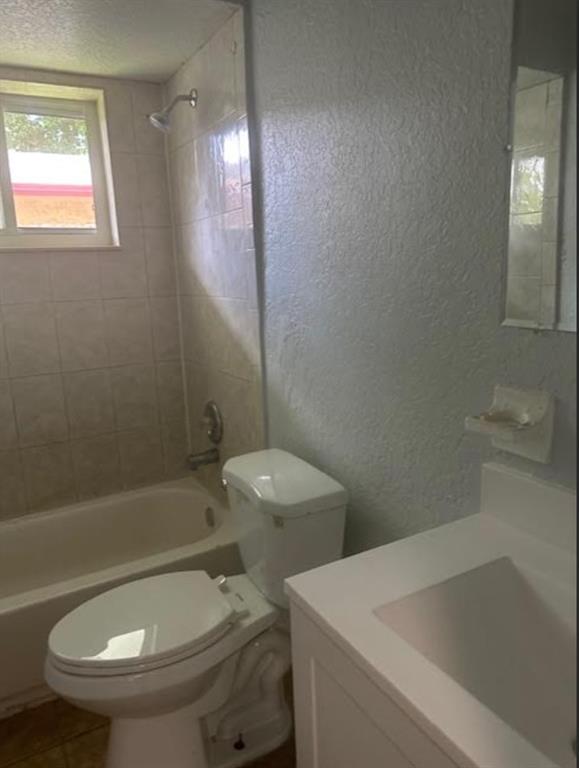 332 Southwest 2nd Place, Unit 3 Pompano Beach, FL 33060 - Photo 6 of 11 a white toilet sitting next to a bath tub