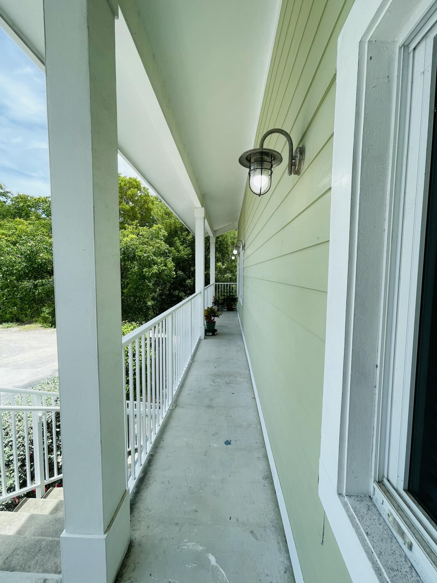 102940 Overseas Highway, Unit 2 Key Largo, FL 33037 - Photo 14 of 39 a view of a porch