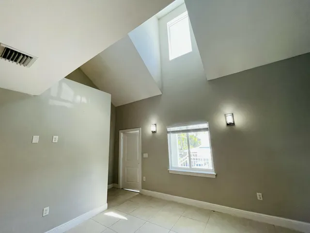 a bathroom with a sink and a glass door shower