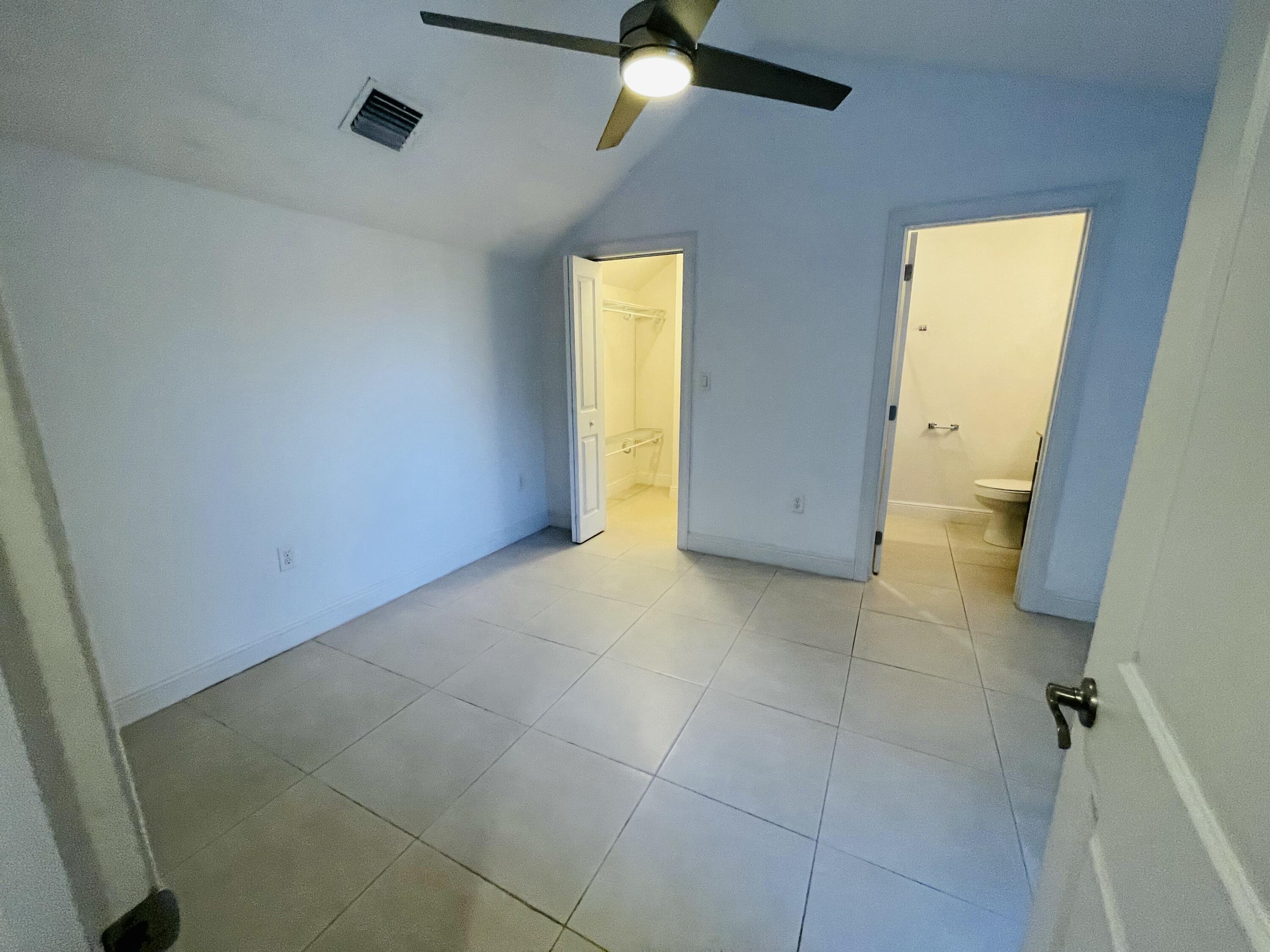 102940 Overseas Highway, Unit 2 Key Largo, FL 33037 - Photo 34 of 39 a view of an empty room with a bathroom
