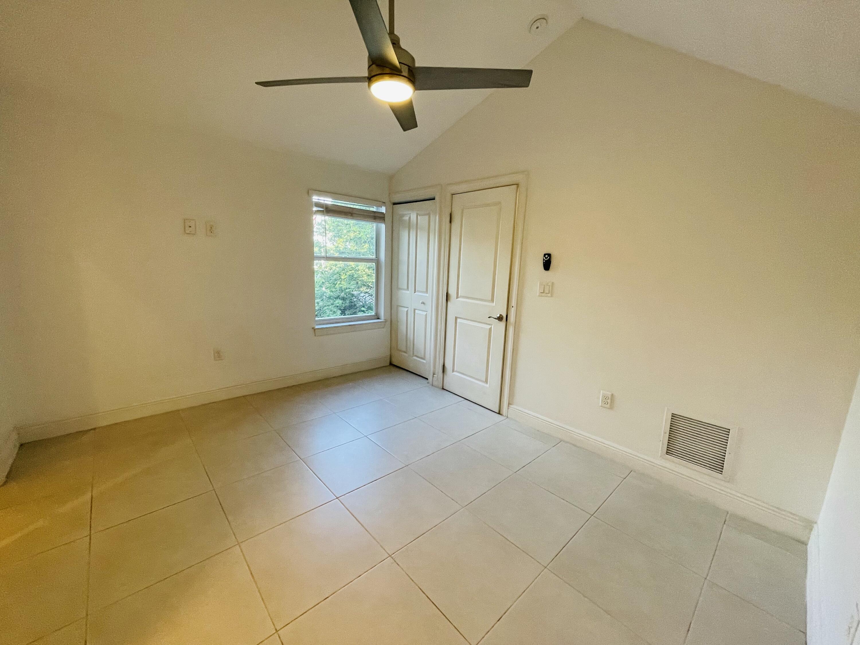 102940 Overseas Highway, Unit 2 Key Largo, FL 33037 - Photo 36 of 39 a view of an empty room with a window