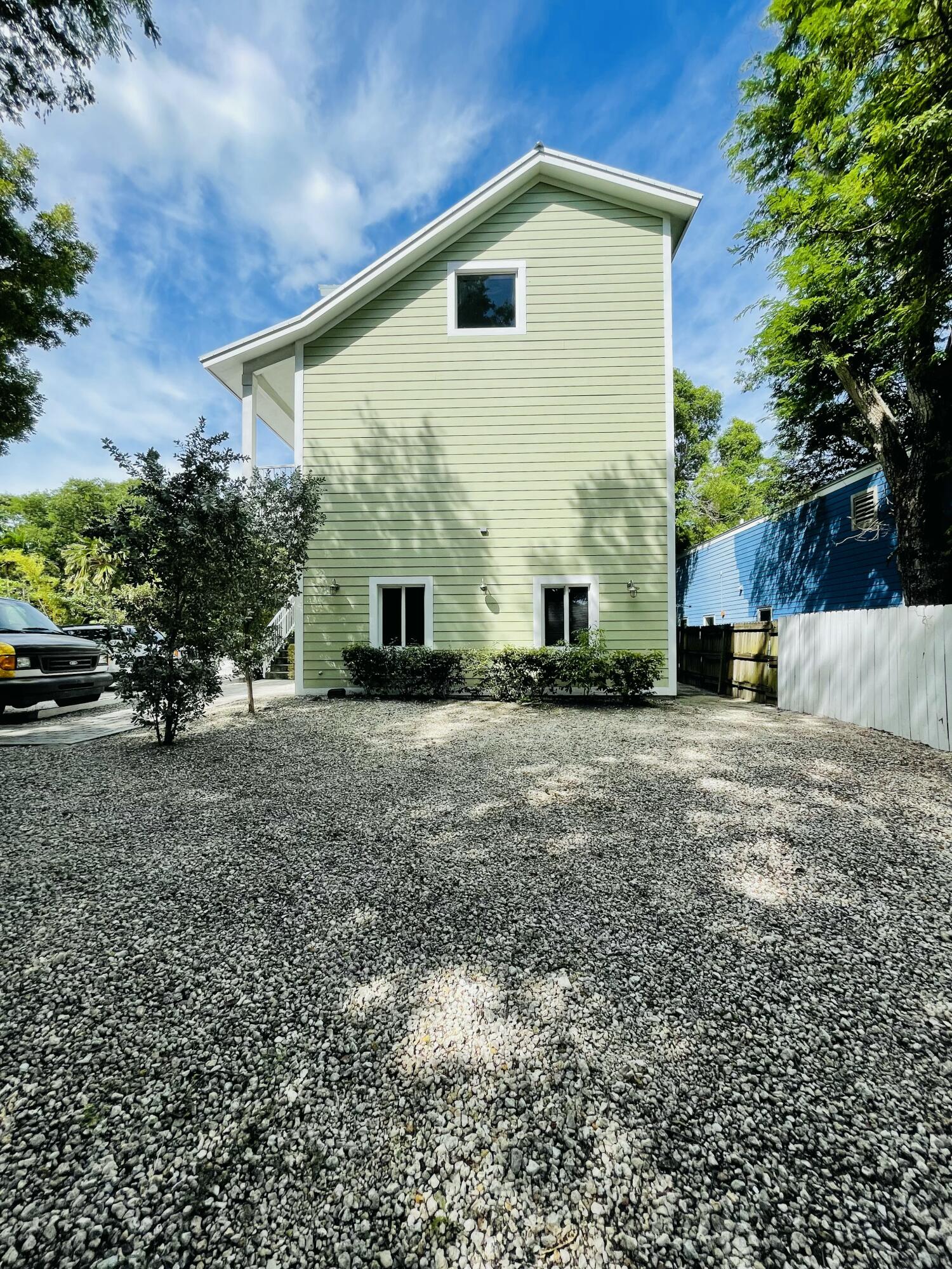 102940 Overseas Highway, Unit 2 Key Largo, FL 33037 - Photo 4 of 39 a view of a house with a yard