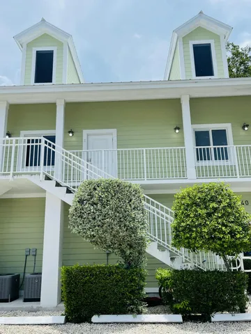 front view of a house with a garden