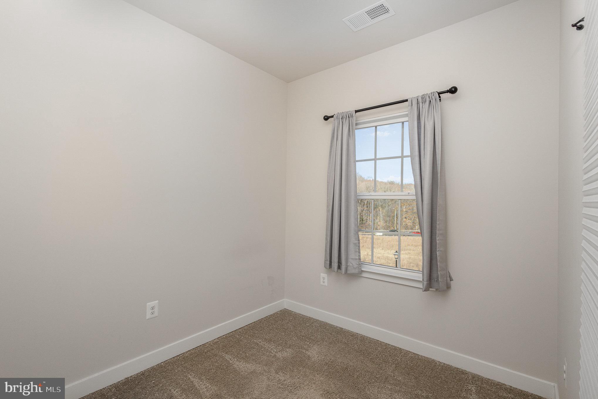 1002 Alum Spring Road Fredericksburg, VA 22401 - Photo 16 of 23 an empty room with windows and closet