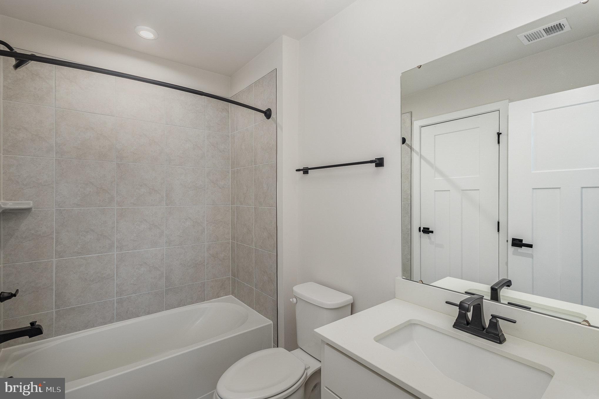 1002 Alum Spring Road Fredericksburg, VA 22401 - Photo 21 of 23 a bathroom with a sink toilet and shower