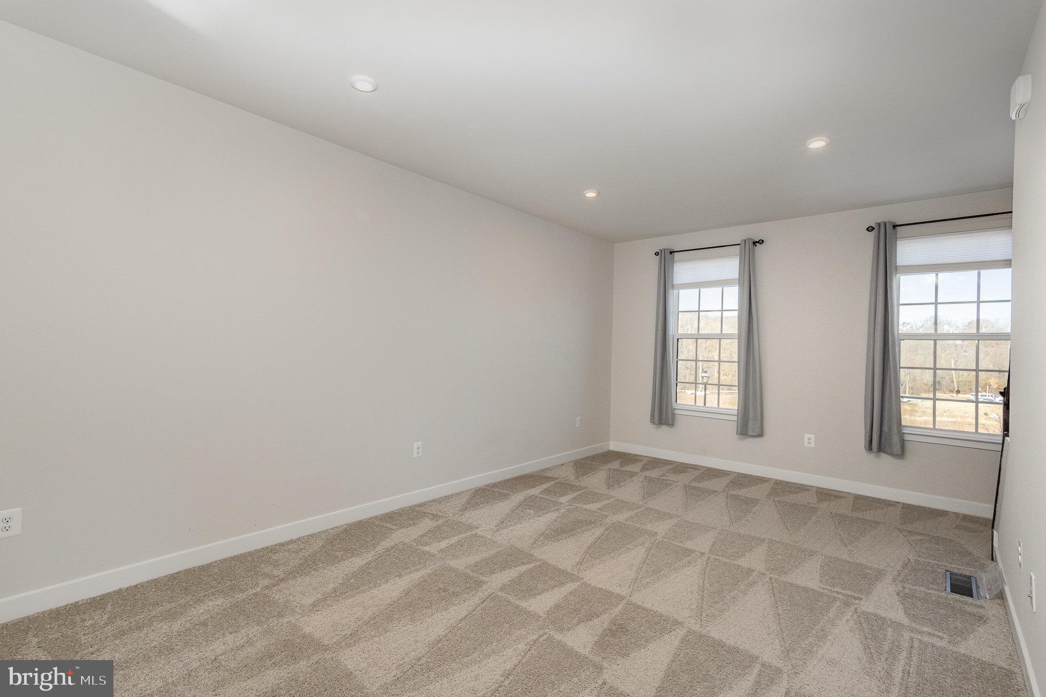 1002 Alum Spring Road Fredericksburg, VA 22401 - Photo 4 of 23 a view of an empty room with a window