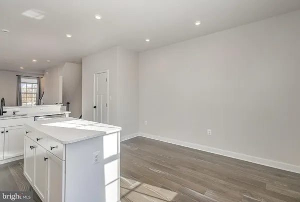 an empty room with wooden floor