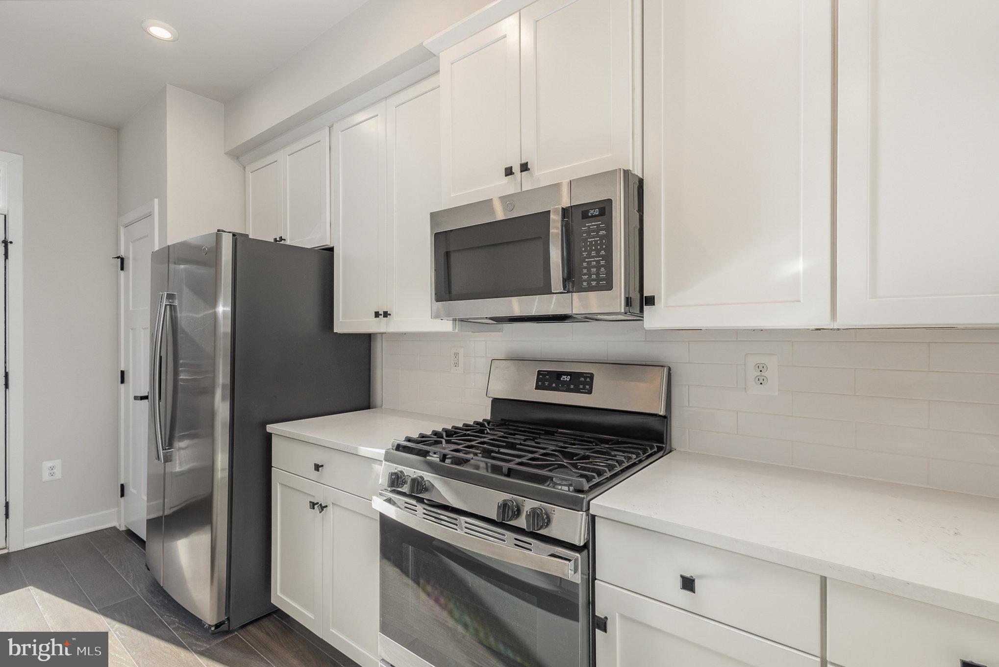 1002 Alum Spring Road Fredericksburg, VA 22401 - Photo 9 of 23 a kitchen with stainless steel appliances a refrigerator stove and microwave