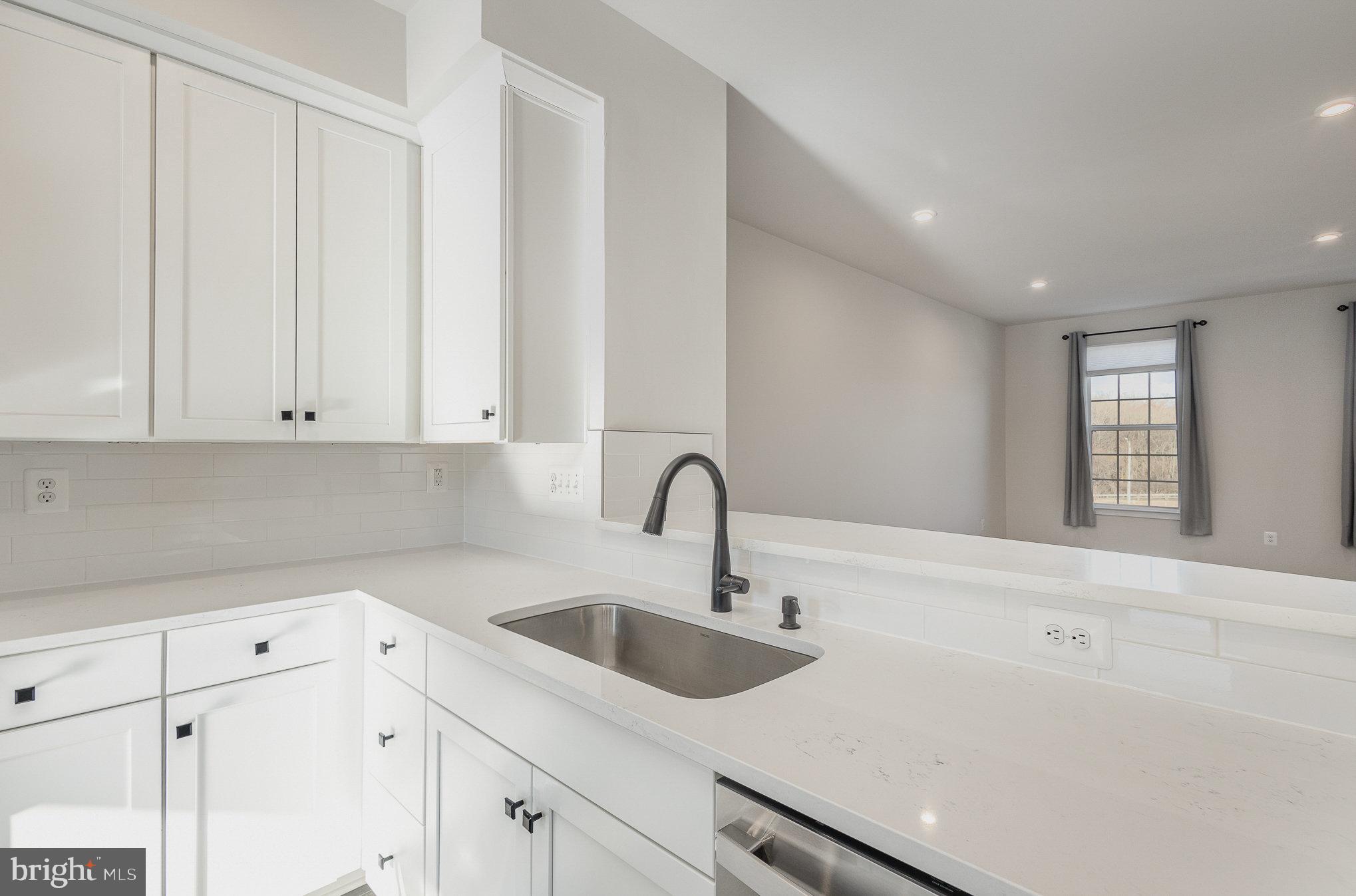 1002 Alum Spring Road Fredericksburg, VA 22401 - Photo 10 of 23 a kitchen with a sink cabinets and window