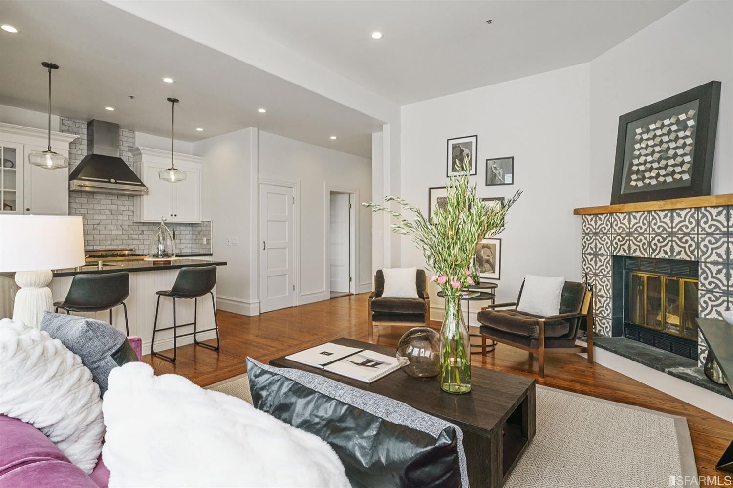 a living room with furniture and a fireplace