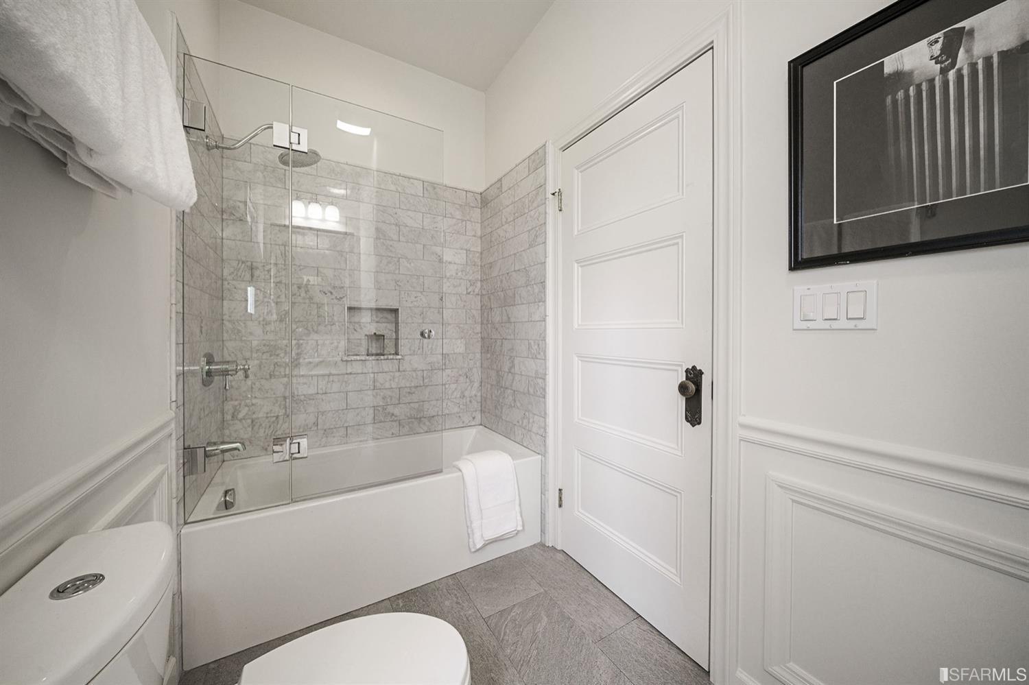 617 Broderick Street, Unit B San Francisco, CA 94117 - Photo 12 of 36 a bathroom with a bathtub shower sink vanity and toilet