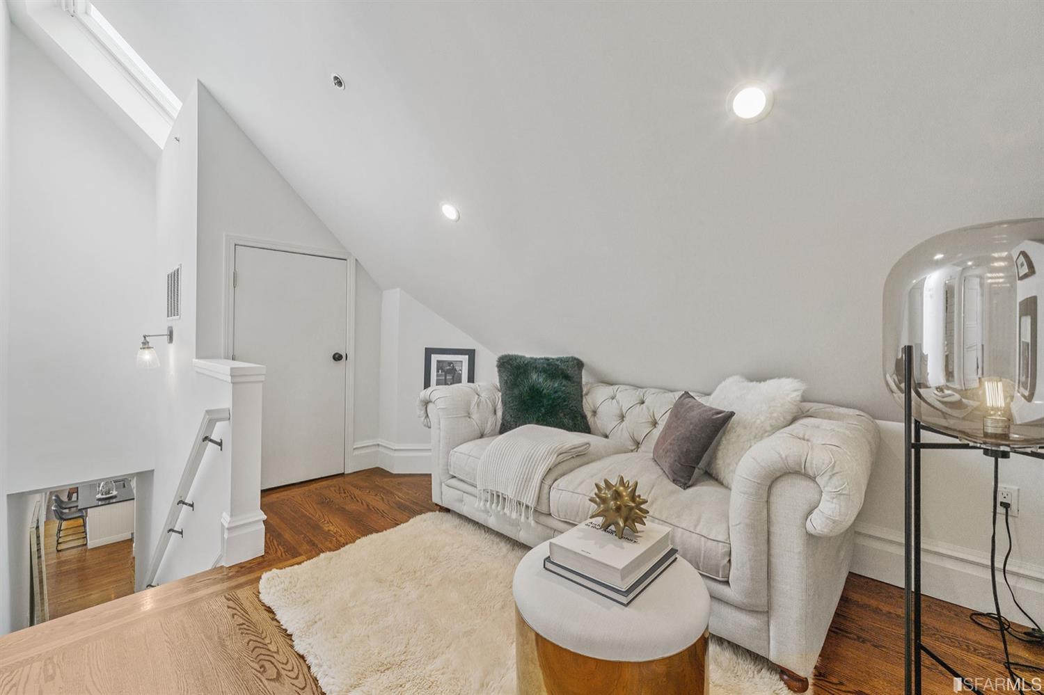 617 Broderick Street, Unit B San Francisco, CA 94117 - Photo 13 of 36 a bedroom with furniture and a wooden floor