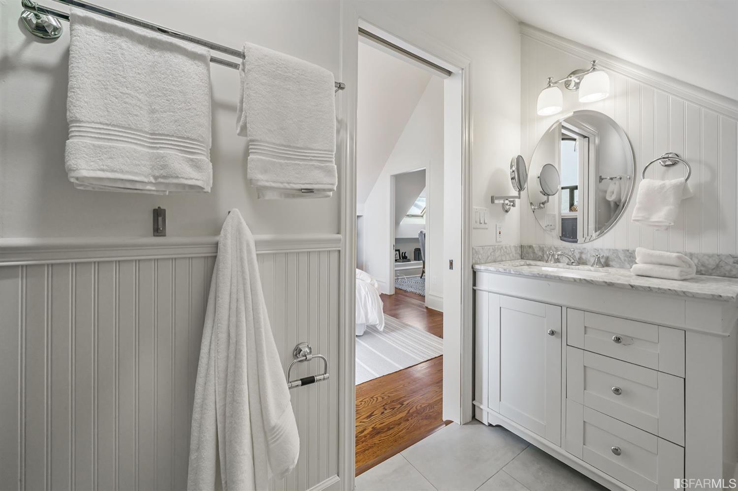 617 Broderick Street, Unit B San Francisco, CA 94117 - Photo 22 of 36 a bathroom with a double vanity sink and a mirror