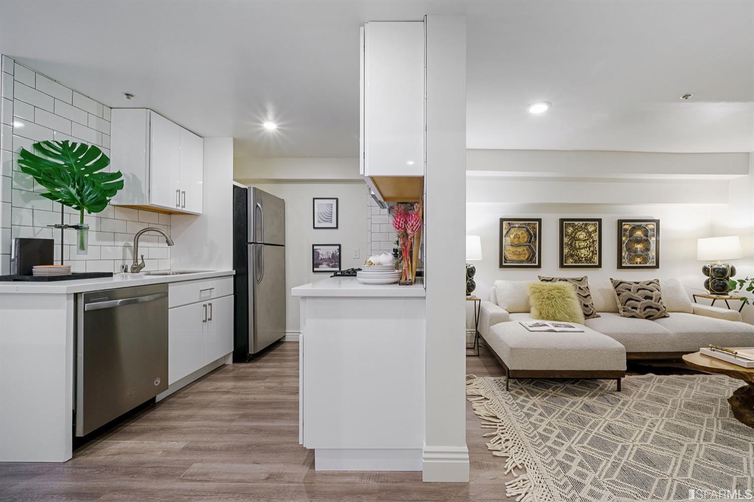 617 Broderick Street, Unit B San Francisco, CA 94117 - Photo 23 of 36 a living room with furniture and a kitchen view