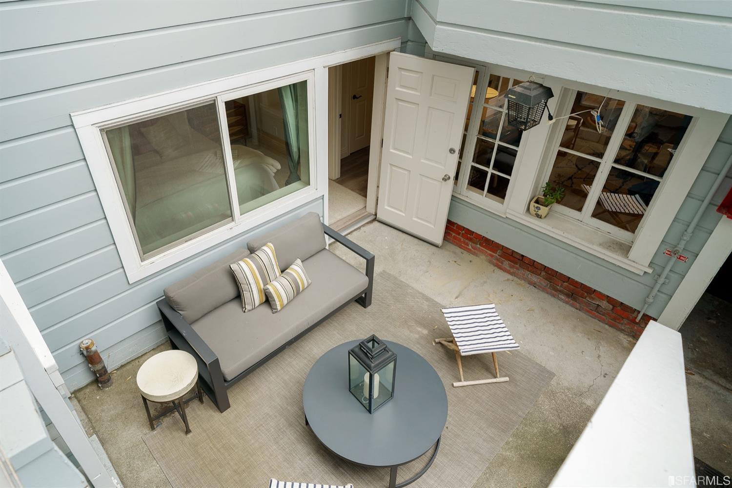 617 Broderick Street, Unit B San Francisco, CA 94117 - Photo 31 of 36 a living room with furniture and a rug