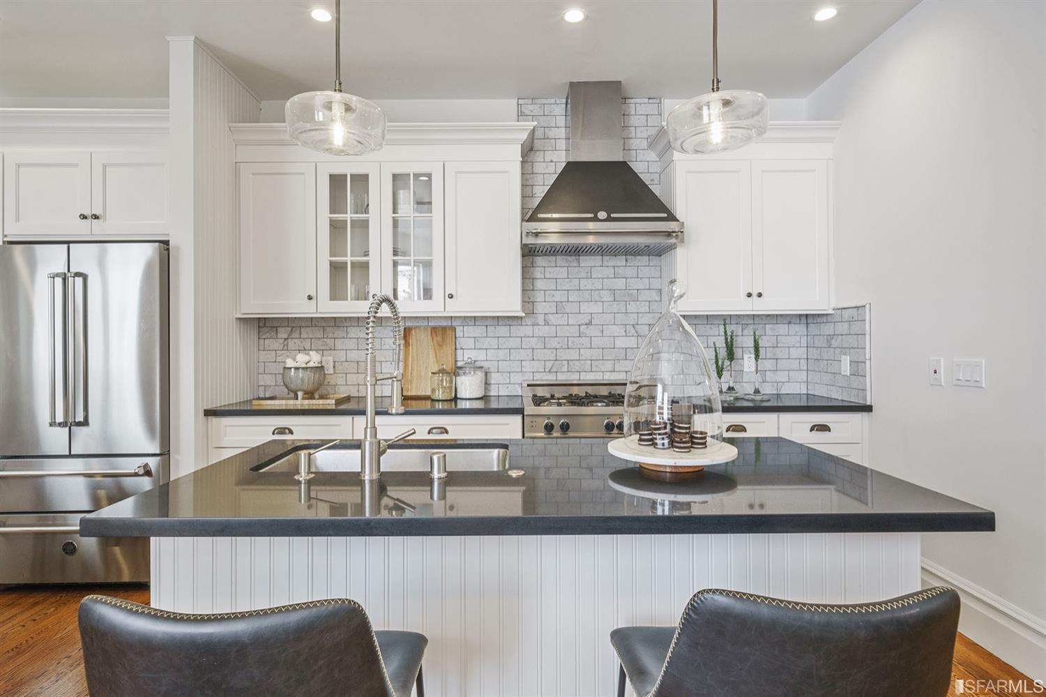 617 Broderick Street, Unit B San Francisco, CA 94117 - Photo 7 of 36 a kitchen with stainless steel appliances granite countertop a sink a stove and a refrigerator