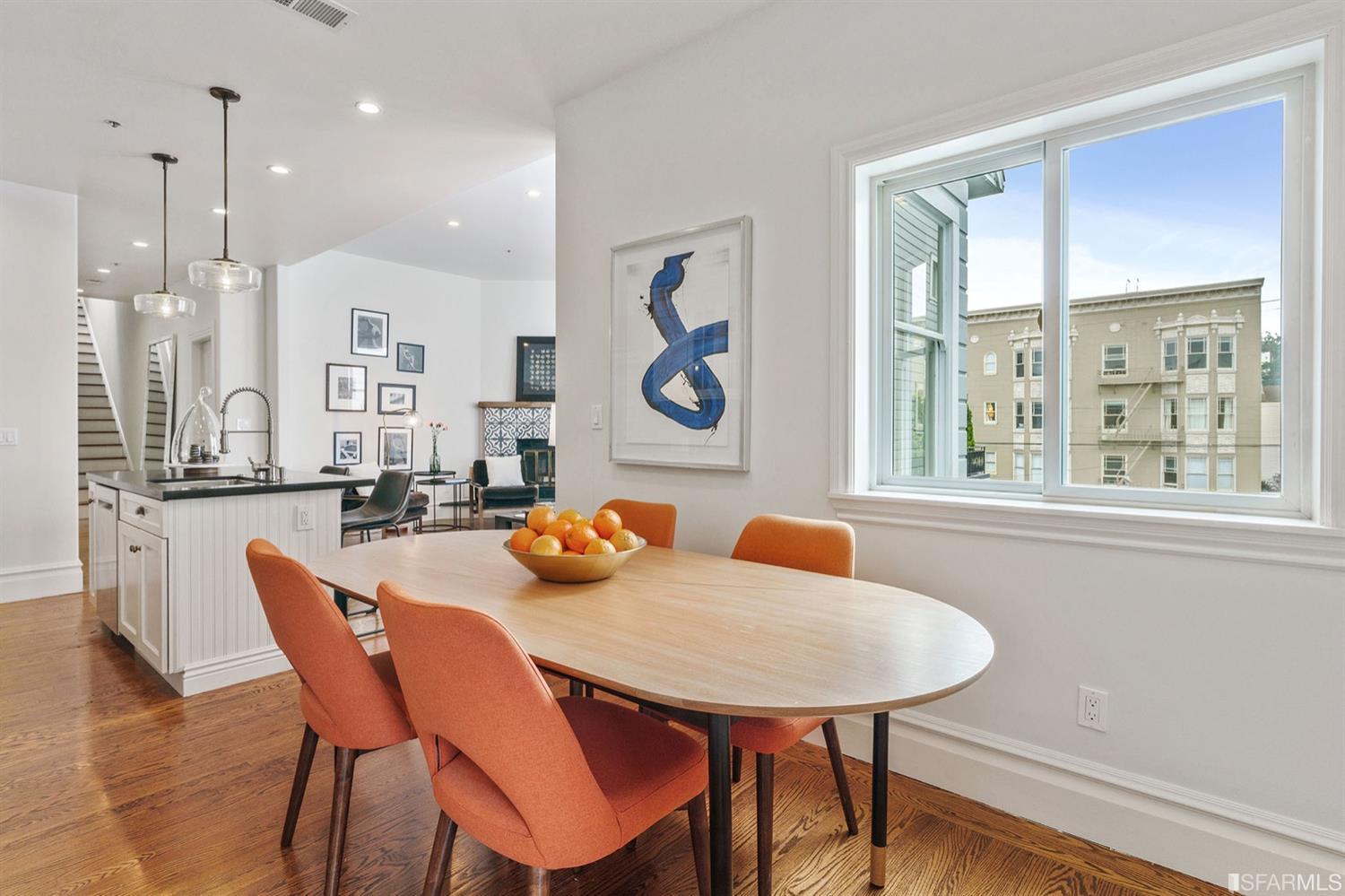 617 Broderick Street, Unit B San Francisco, CA 94117 - Photo 8 of 36 a dining room with furniture a large window and wooden floor