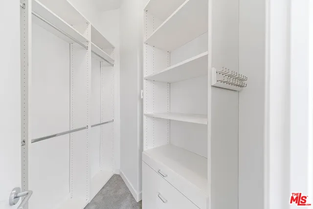 a view of an empty walk in closet