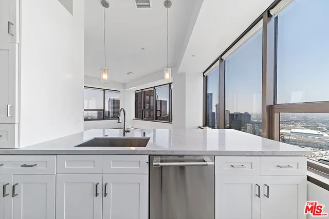 a kitchen with a sink and a window