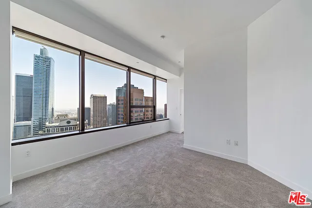 a view of empty room with floor to ceiling window