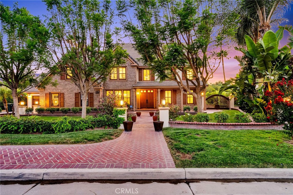 14207 Ashton Lane Riverside, CA 92508 - Photo 1 of 1 a view of a brick house with a yard and plants