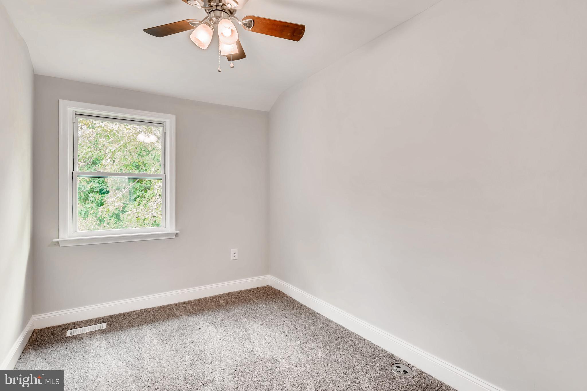 1315 Silverthorne Road Baltimore, MD 21239 - Photo 14 of 28 an empty room with a window