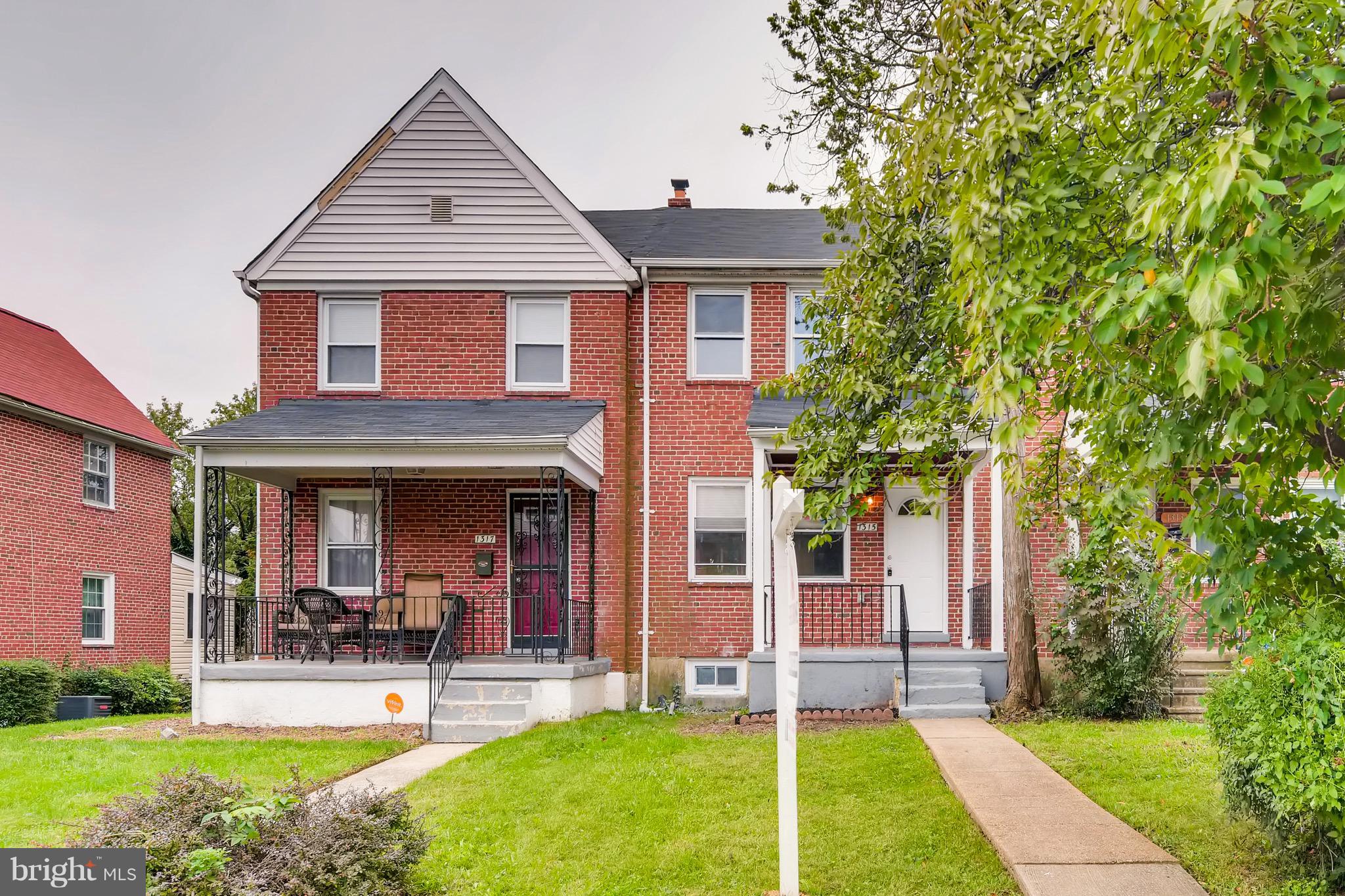 1315 Silverthorne Road Baltimore, MD 21239 - Photo 24 of 28 front view of a house with a yard