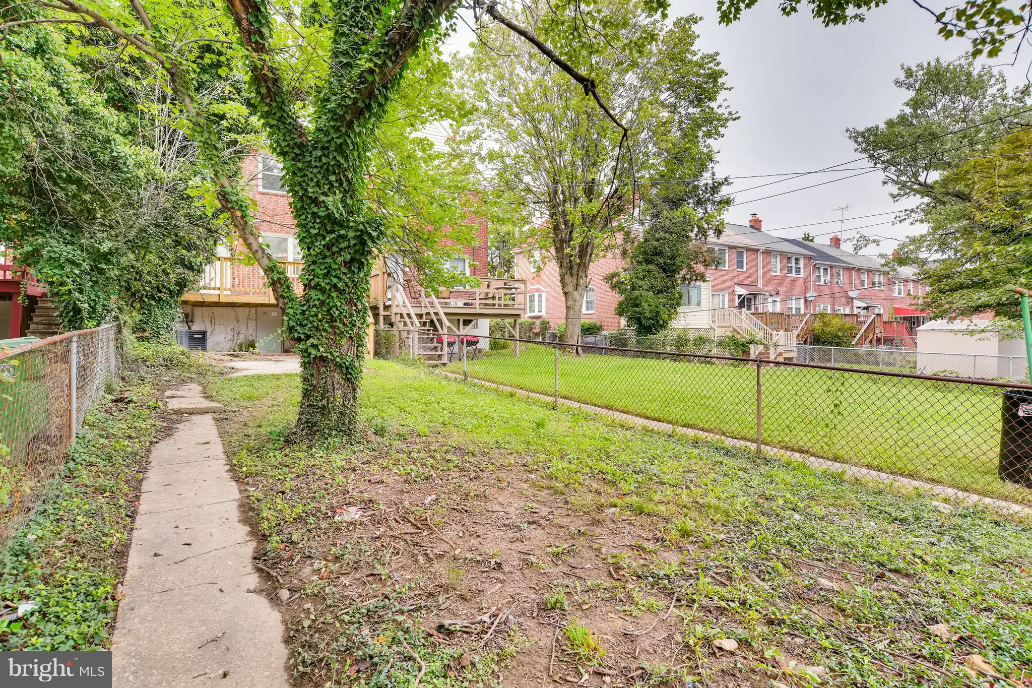 1315 Silverthorne Road Baltimore, MD 21239 - Photo 28 of 28 a view of a park with large trees