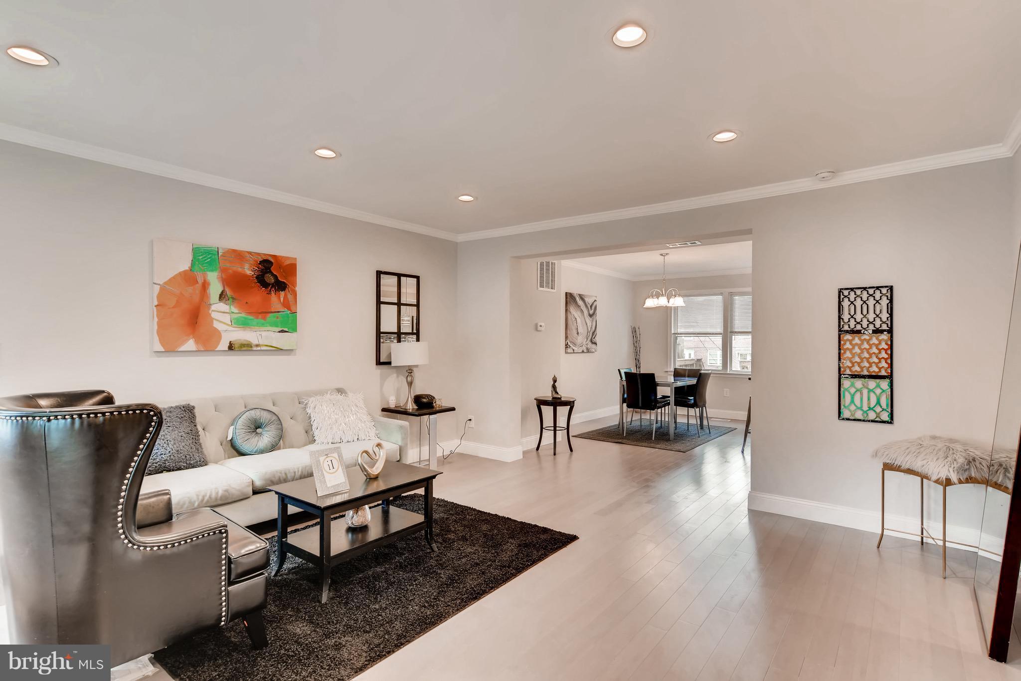 1315 Silverthorne Road Baltimore, MD 21239 - Photo 6 of 28 a living room with furniture and wooden floor