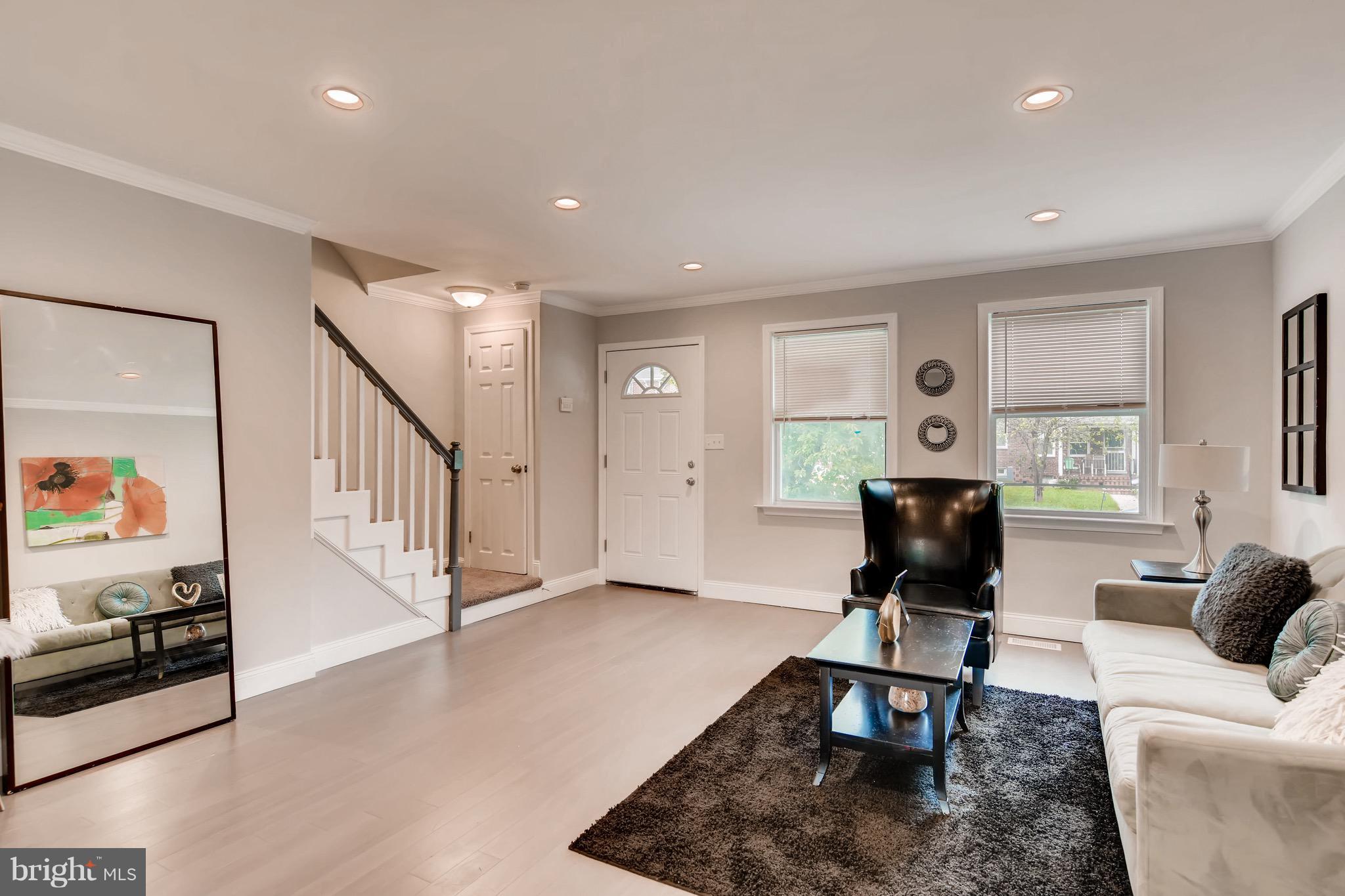 1315 Silverthorne Road Baltimore, MD 21239 - Photo 7 of 28 a living room with furniture and a wooden floor
