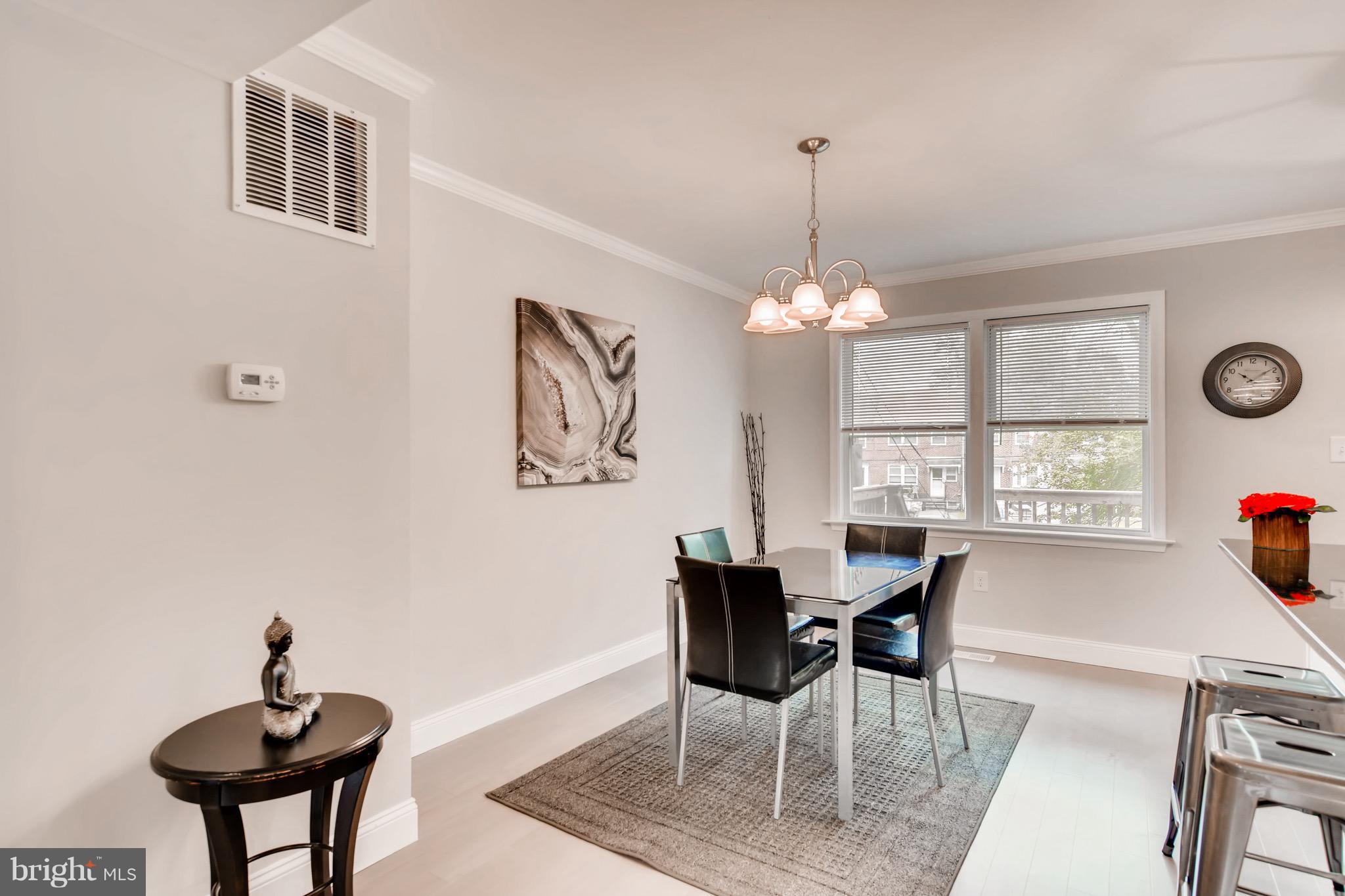 1315 Silverthorne Road Baltimore, MD 21239 - Photo 8 of 28 a view of a dining room with furniture and window