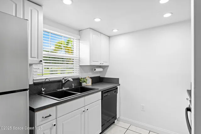 a kitchen that has a sink and a window