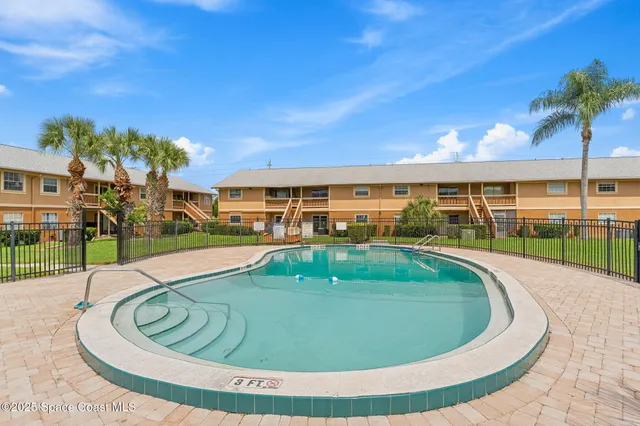 a view of a park with swings and slides