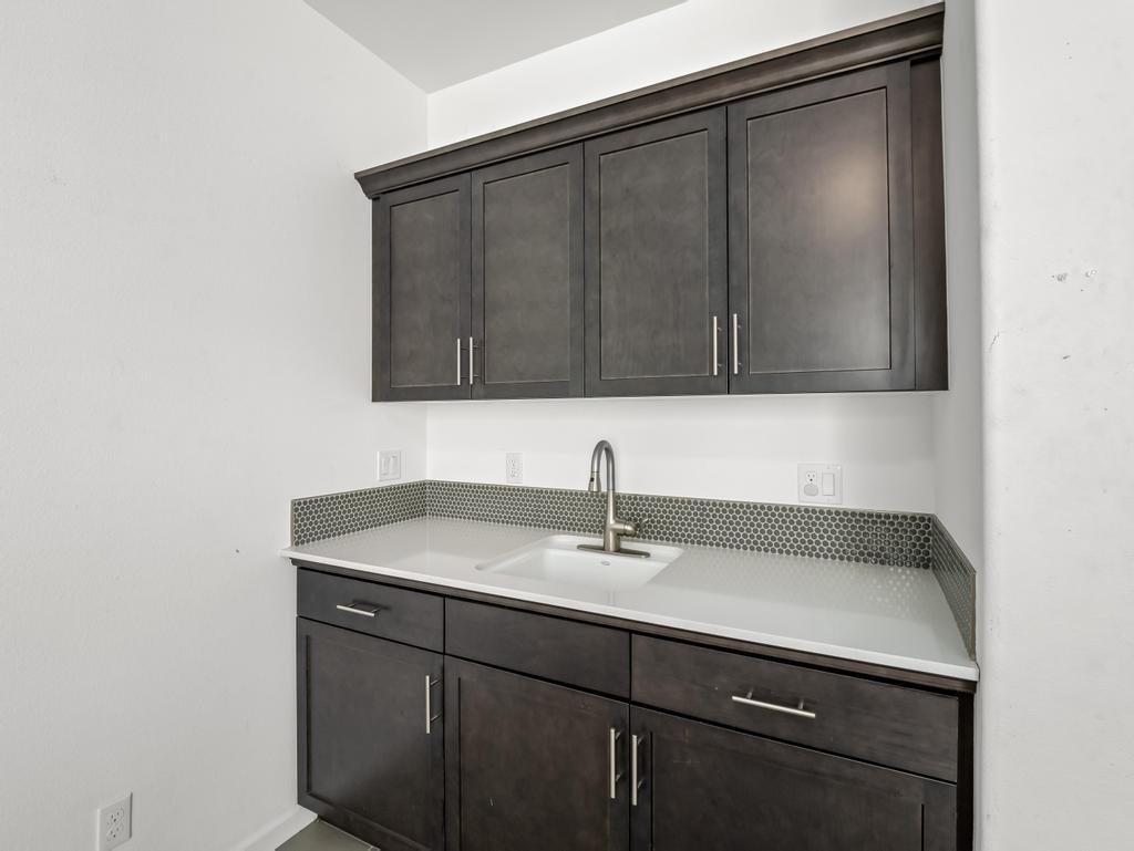 3438 Lincoln Avenue Clovis, CA 93619 - Photo 19 of 52 a bathroom with a sink and cabinets